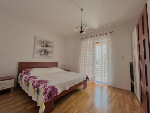 Posteľ alebo postele v izbe v ubytovaní Apartment Lola