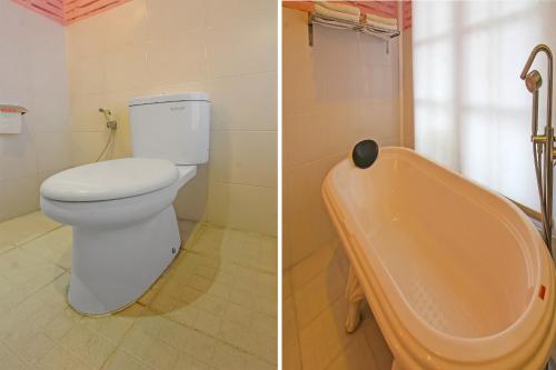 a bathroom with a toilet and a bath tub at Capital O 92559 Sweet Peach House in Senggigi