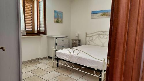 Postel nebo postele na pokoji v ubytování Castello di Andrano - Splendido bilocale con WiFi a 5 minuti dal mare