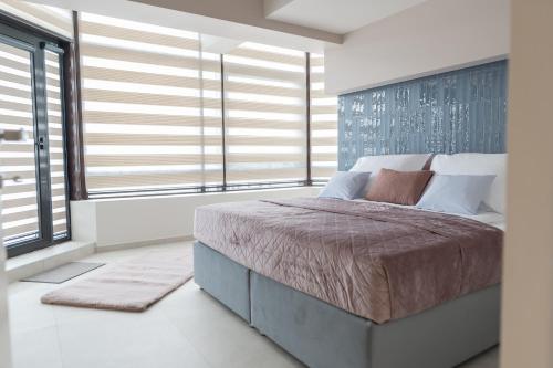 Ένα ή περισσότερα κρεβάτια σε δωμάτιο στο The Dome Aparthotel
