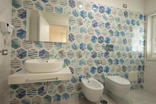 a bathroom with a sink and a toilet at Rosy's House in Scafati