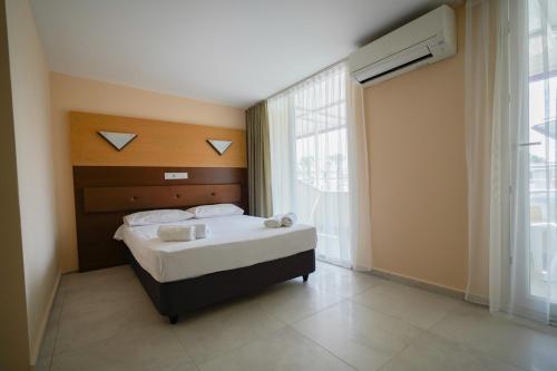 Postel nebo postele na pokoji v ubytování Wassermann Hotel