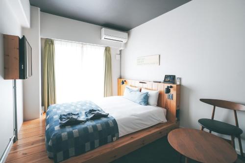 En eller flere senge i et værelse på Anchor Hotel Fukuyama