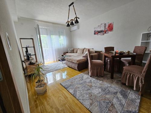 a living room with a couch and a table at Sirob bubanj in Kragujevac