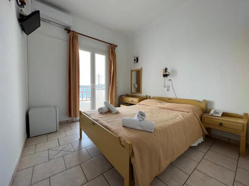 Postel nebo postele na pokoji v ubytování Asterias Hotel - Seafront
