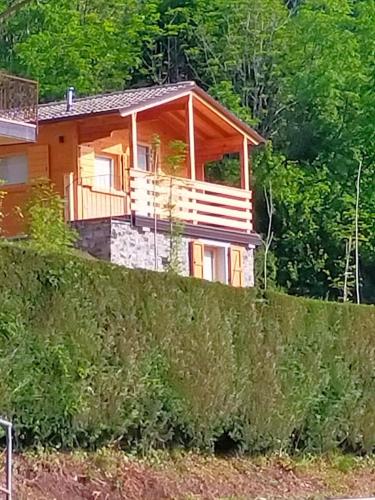 a house sitting on top of a hill at CHALET SIMONETTA - Locanda da Tullio in Capovalle