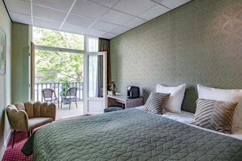 Cama o camas de una habitación en Hotel Atlantis Amsterdam