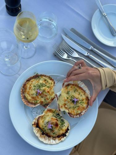 a plate with two small pizzas on a table at Marienlyst Strandhotel in Helsingør