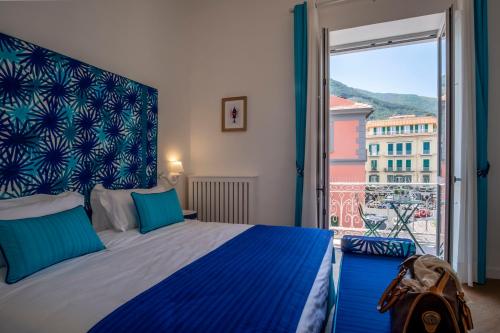 a bedroom with a bed and a large window at Sea View Luxury Apartment in Castellammare di Stabia