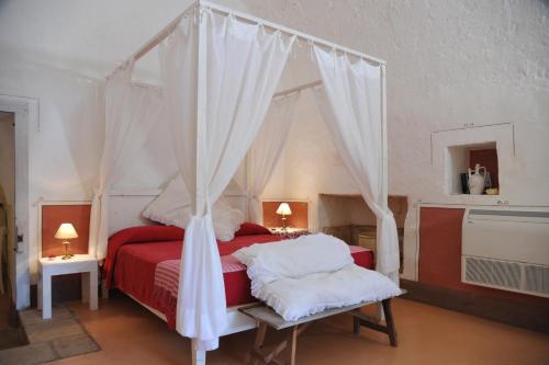 Ліжко або ліжка в номері Masseria Cristo