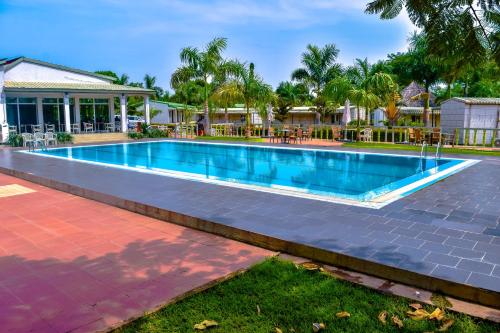 a swimming pool in the backyard of a house at Grand Hotel Juba in Juba