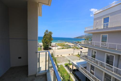 a view of the ocean from the balcony of a building at Maor Hotel in Vlorë
