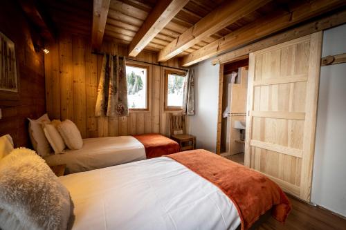 Cama o camas de una habitación en Les Chalets du Cocoon