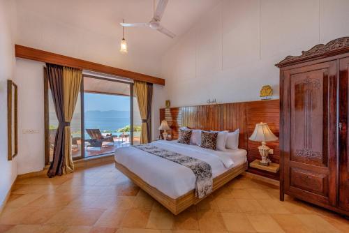 a bedroom with a large bed and a large window at SaffronStays Shambhala Lakeside-Infinity Pool Villa in Pawna in Malavli