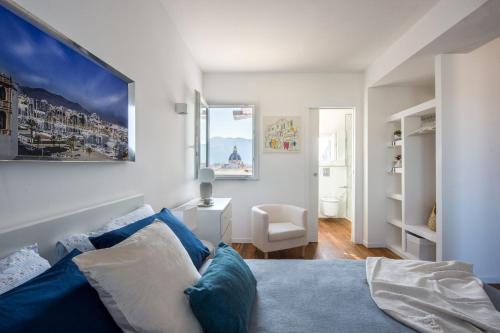 a bedroom with a bed and a desk and a window at Vista sulle Cupole by Wonderful Italy in Palermo