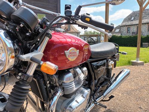 a red motorcycle parked next to a house at Le Miraillet, gîte in Saint-Illide