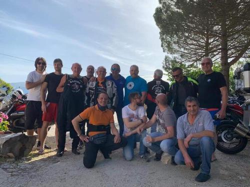a group of people posing for a picture at Hotel Grazia Ristorante in LʼAquila