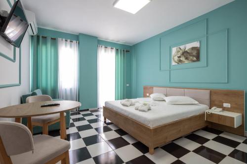 Compas Boutique Hotelにあるベッド