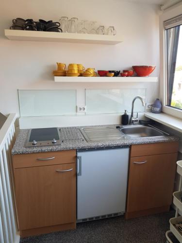 a kitchen with a sink and a counter top at Deluxe STUDIO-appartement Heemstede Zandvoort in Heemstede