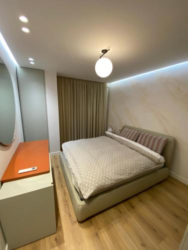 Katil atau katil-katil dalam bilik di Tirana Primo Apartment