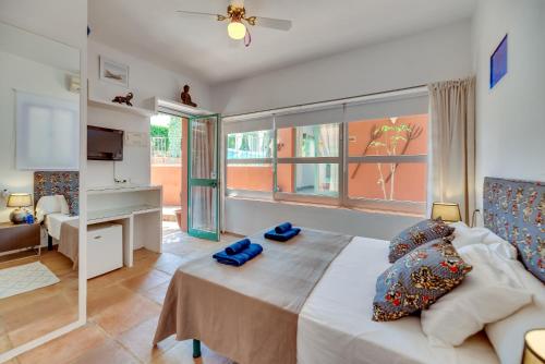 a bedroom with a bed and a living room at Villa Tiphareth in Marbella