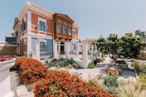 a house with flowers in front of it at Saray Monumental Luxury Villa Medieval Town, Rhodes in Rhodes Town