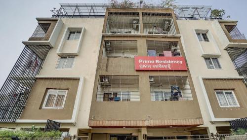 a building with a sign on the side of it at Super Capital O Sayhallo Prime Residency in Bhubaneshwar