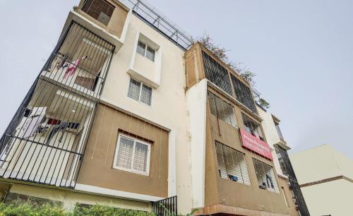 a tall building with barred windows on the side of it at Super Capital O Sayhallo Prime Residency in Bhubaneshwar