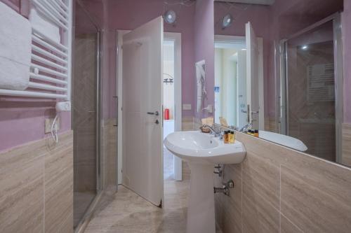 a bathroom with a sink and a toilet and a shower at Le Versegge Resort in Braccagni