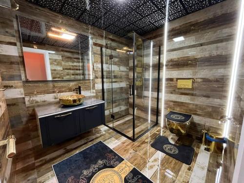 a bathroom with a shower and a sink and a toilet at Квартира Versace 3+1 в Анталии in Hurmaköy