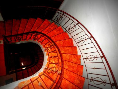 a view of a spiral staircase in a building at Ratih Bali Hostel in Denpasar