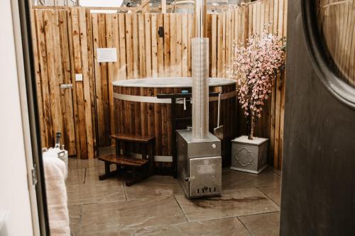 a room with a heater and a wooden fence at The Old Brewery, Ulverston in Ulverston