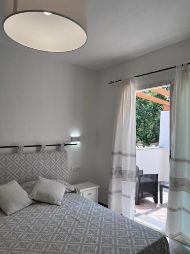 Postel nebo postele na pokoji v ubytování Sa Jacca Albergo Rurale
