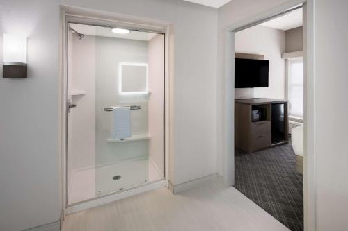 a bathroom with a glass shower in a room at Comfort Inn & Suites Fishers - Indianapolis in Fishers
