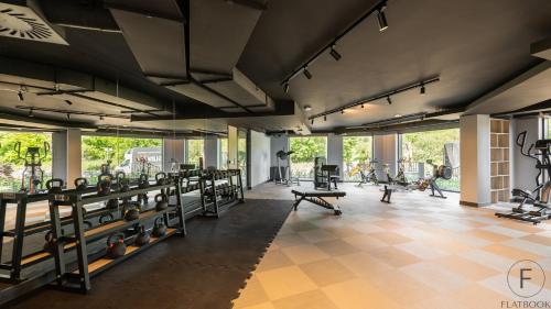 a gym with a lot of equipment in a room at Flatbook - Seaside Apartments Porto Gdańsk in Gdańsk