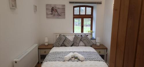 a bedroom with a bed with a stuffed animal on it at Naval base Quietness Parking LongStays 6Guests in Plymouth