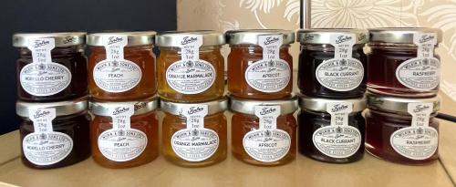 a group of jars of honey sitting on a table at Maesyfelin Isaf B&B in Llanybydder