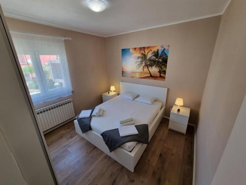 Postel nebo postele na pokoji v ubytování Apartment ANAMARIJA BR. 2