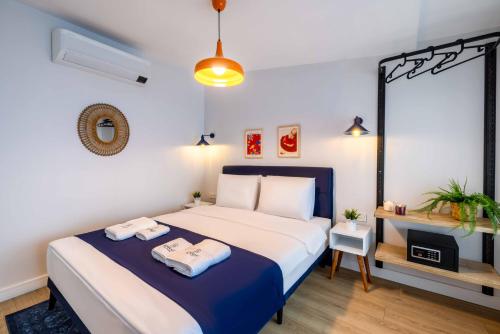 a bedroom with a bed with two towels on it at Monnas Suite in Istanbul