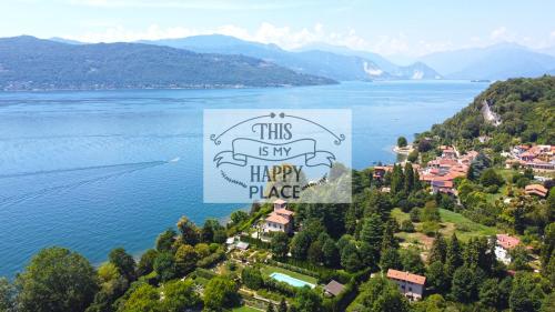 a town on a hill next to a body of water at This is my happy place in Leggiuno