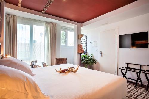 Ένα ή περισσότερα κρεβάτια σε δωμάτιο στο Hotel Madinat