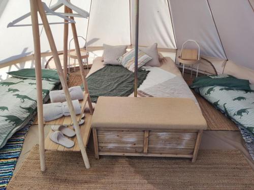 a room with two beds in a tent at Glamping Finca el Olivo in Mijas