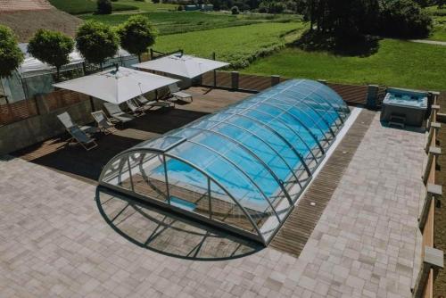 a glass dome with a swimming pool in it at Soba pri nam 