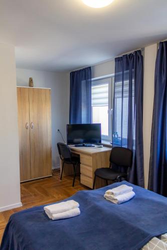 Postel nebo postele na pokoji v ubytování Skarbek Iława, pokoje i apartamenty