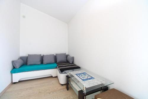 a small room with a bed and a table at House Volme 2255 in Banjole