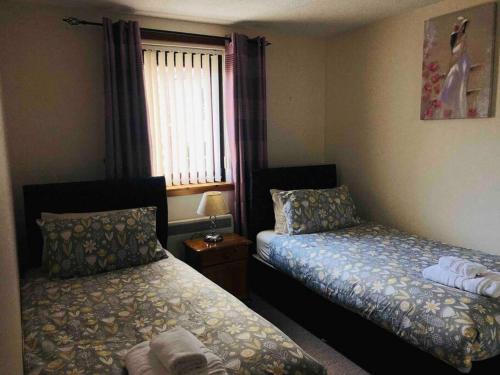 Postel nebo postele na pokoji v ubytování Crown Apartment City Centre
