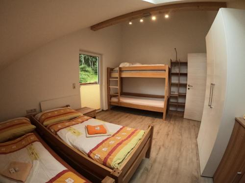 Poschodová posteľ alebo postele v izbe v ubytovaní Appartement Intersport Maria Alm