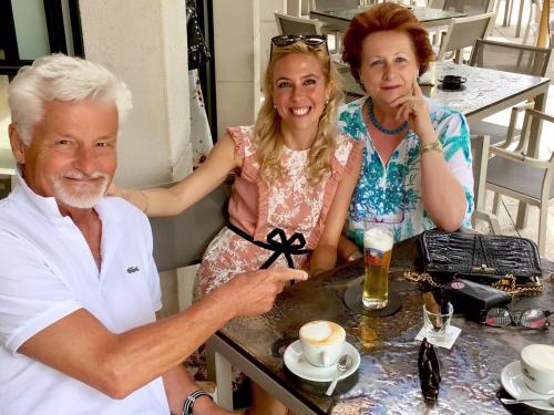 a man and two women sitting at a table at Hotel Alfieri in Sirmione
