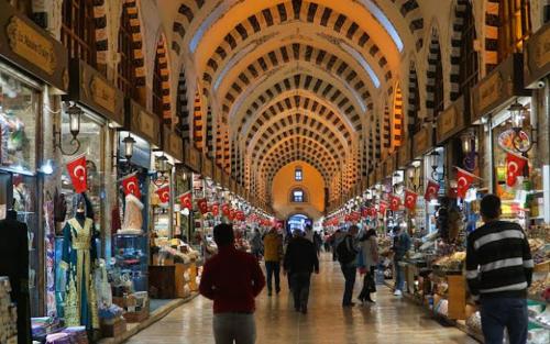 a group of people walking through a shopping mall at Solomon's Mansion Hotel Istanbul in Istanbul
