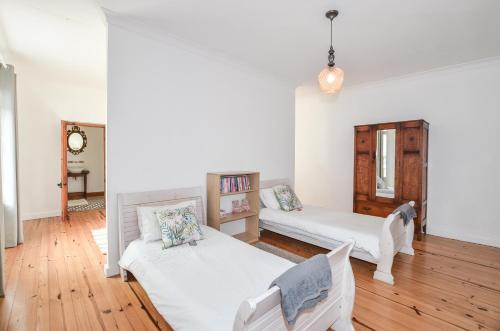 a living room with two beds and a couch at Contreberg Manor House in Darling